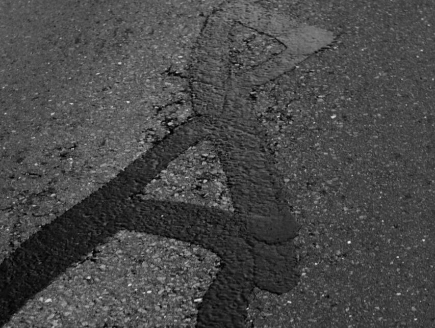 Asphalt filled cracks